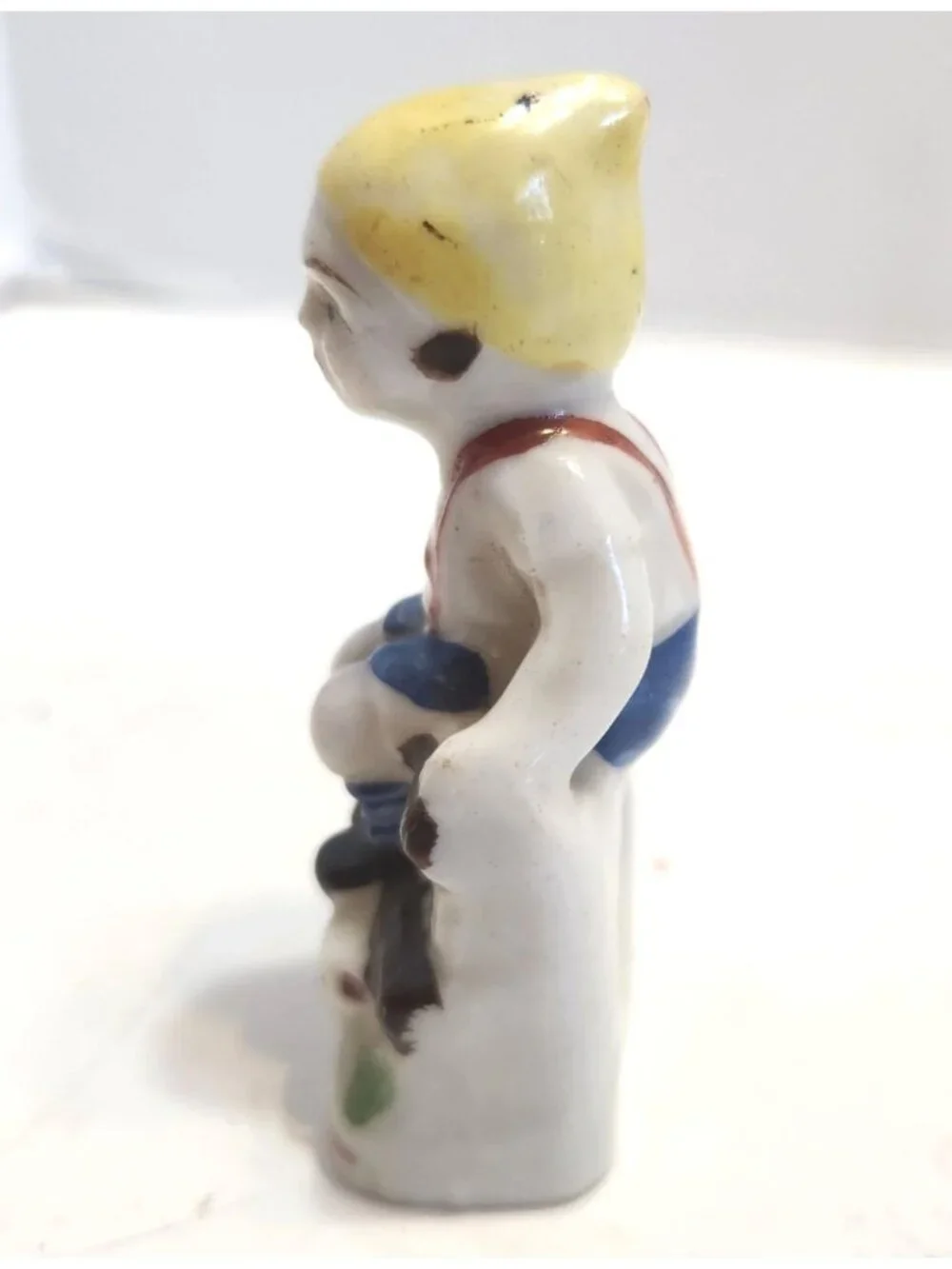 Vintage Mini Hand-Painted Porcelain Figurine Of A Boy Sitting On A Bench READ